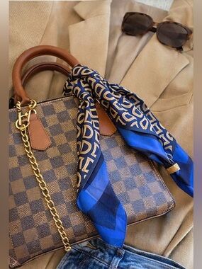 Elevated designer inspired monogram scarf in a rich navy, gold, and bold blue